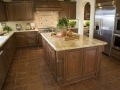 Modern Kitchen with brown tiles.