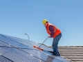 worker and solar panels