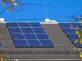 Solar panels on the roof of a large building